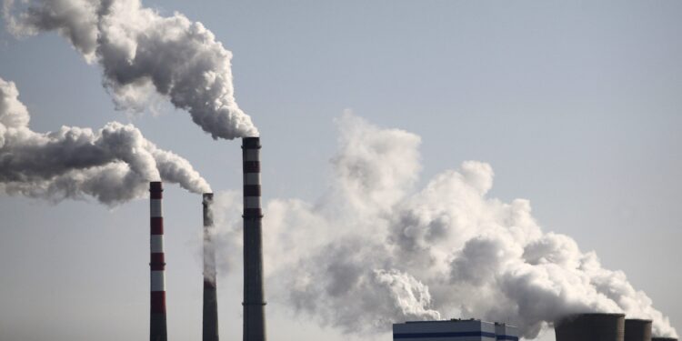 Smoke billows from a power plant in Wuzhong, of the Ningxia Hui Autonomous Region, November 18, 2009. China said on Thursday that its promise to cut carbon intensity up to 45 percent by 2020 is a "binding goal", and that it will use strengthened policies including taxation and financial measures to reach the target. Picture taken November 18, 2009. REUTERS/Stringer (CHINA ENVIRONMENT ENERGY) CHINA OUT. NO COMMERCIAL OR EDITORIAL SALES IN CHINA CLIMATE-COPENHAGEN/