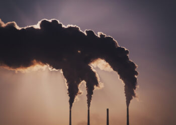 Air pollution clouds of smoke coming from the chimneys. Energy plantCombined heat and power