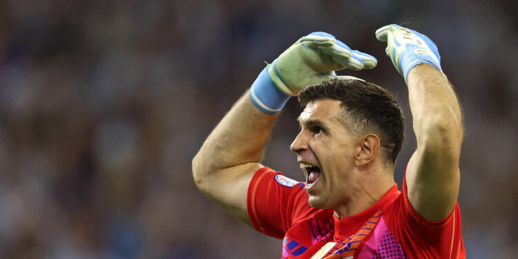 Argentina's goalkeeper #23 Emiliano Martinez celebrates after Ecuador's forward #13 Enner Valencia (out of frame) missed a goal from the penalty spot during the Conmebol 2024 Copa America tournament quarter-final football match between Argentina and Ecuador at NRG Stadium in Houston, Texas, on July 4, 2024. (Photo by CHARLY TRIBALLEAU / AFP)