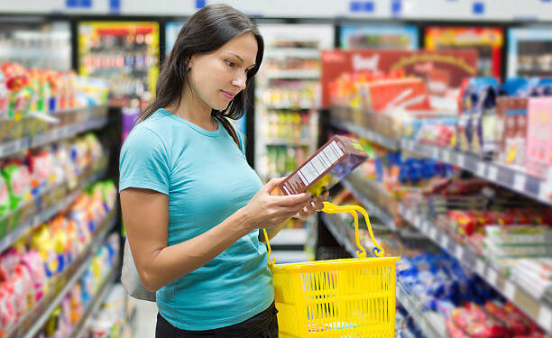 Woman checking food labelling